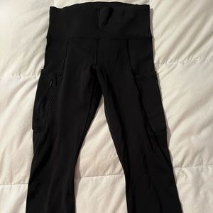 Black Athleta 7/8 leggings with zippered pockets